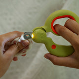 Pet Nail Clippers in use, grooming a pet's nail safely with a creamy donut design.